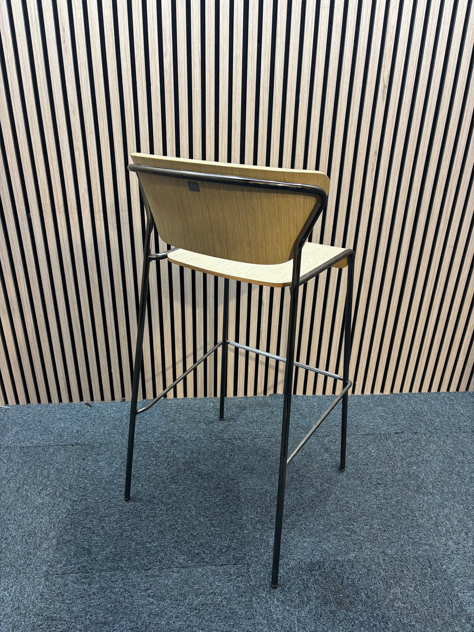 Salo bar stool with natural oak and solid 4 legged black frame
