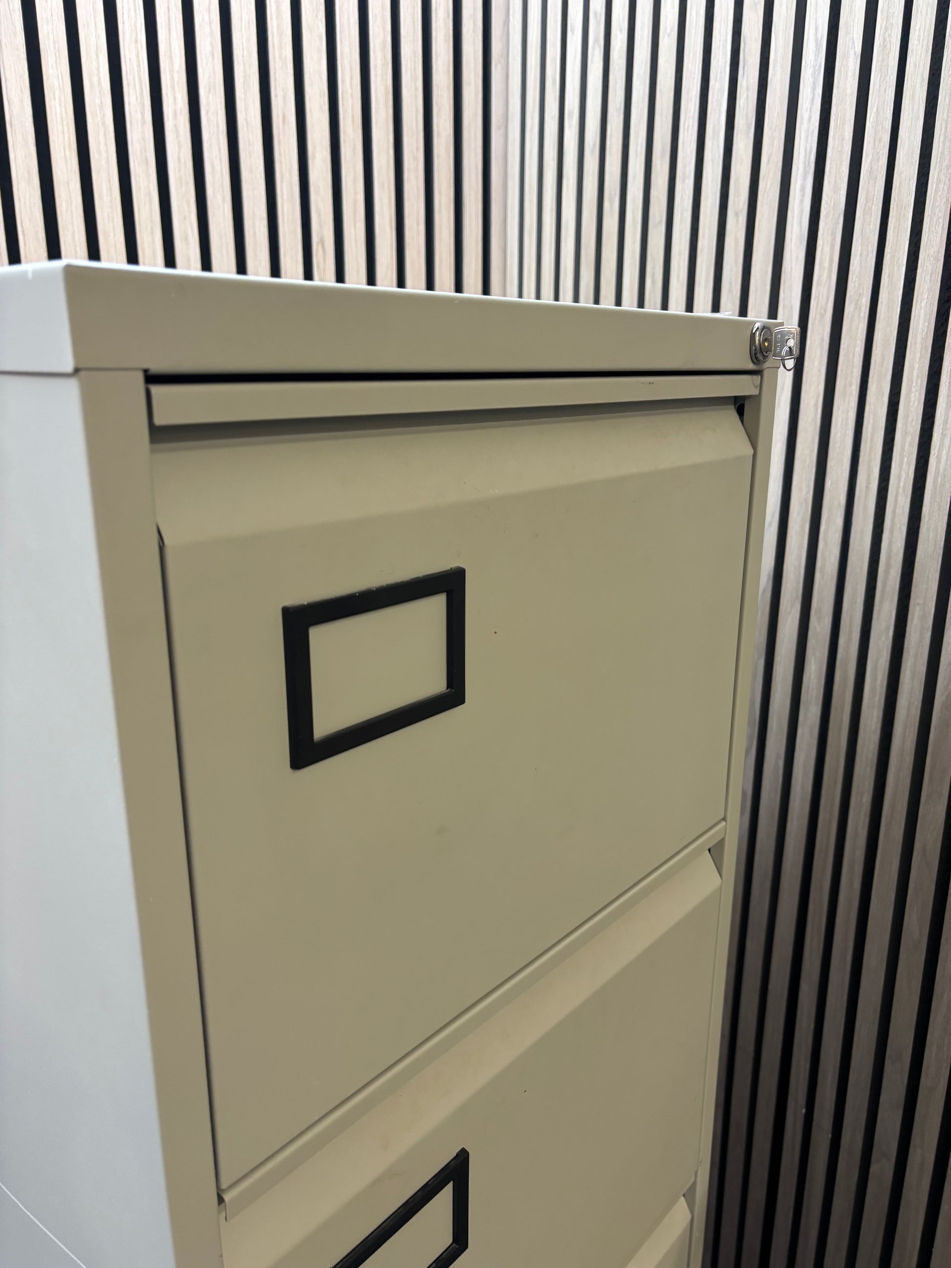 Grey metal 4 drawer filing cabinet with key