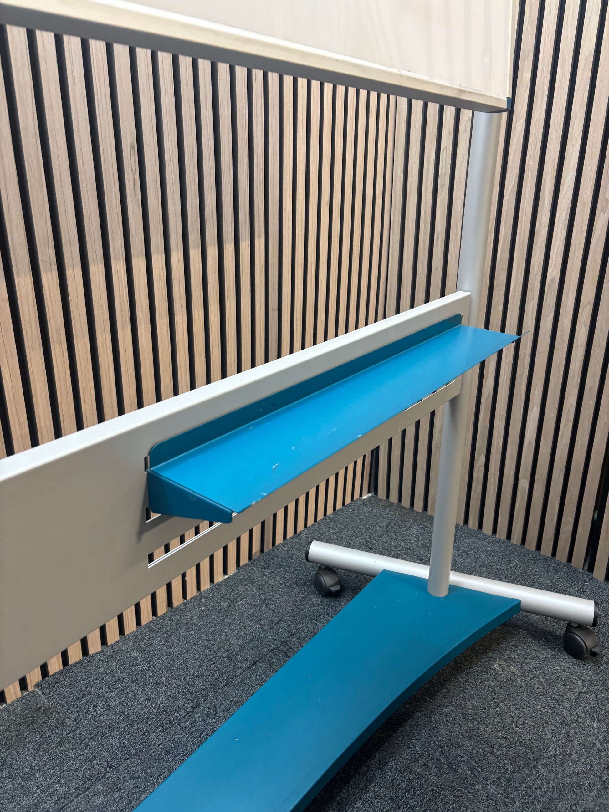 Large mobile whiteboard on castors