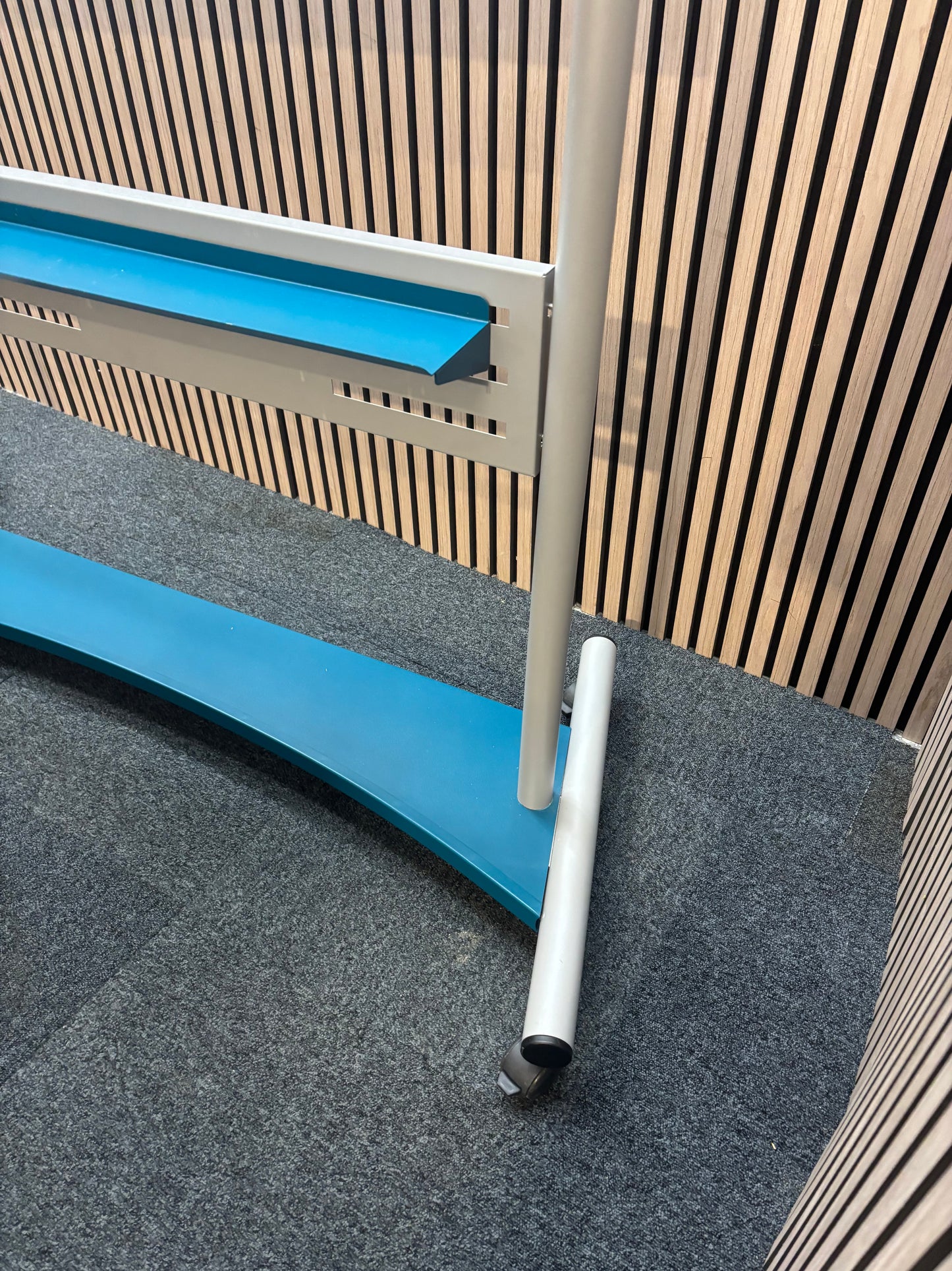 Large mobile whiteboard on castors
