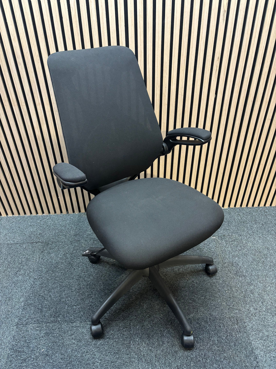 NEW Napier black fabric height adjustable swivel chair with black fabric pivot arms. PRICE INC VAT