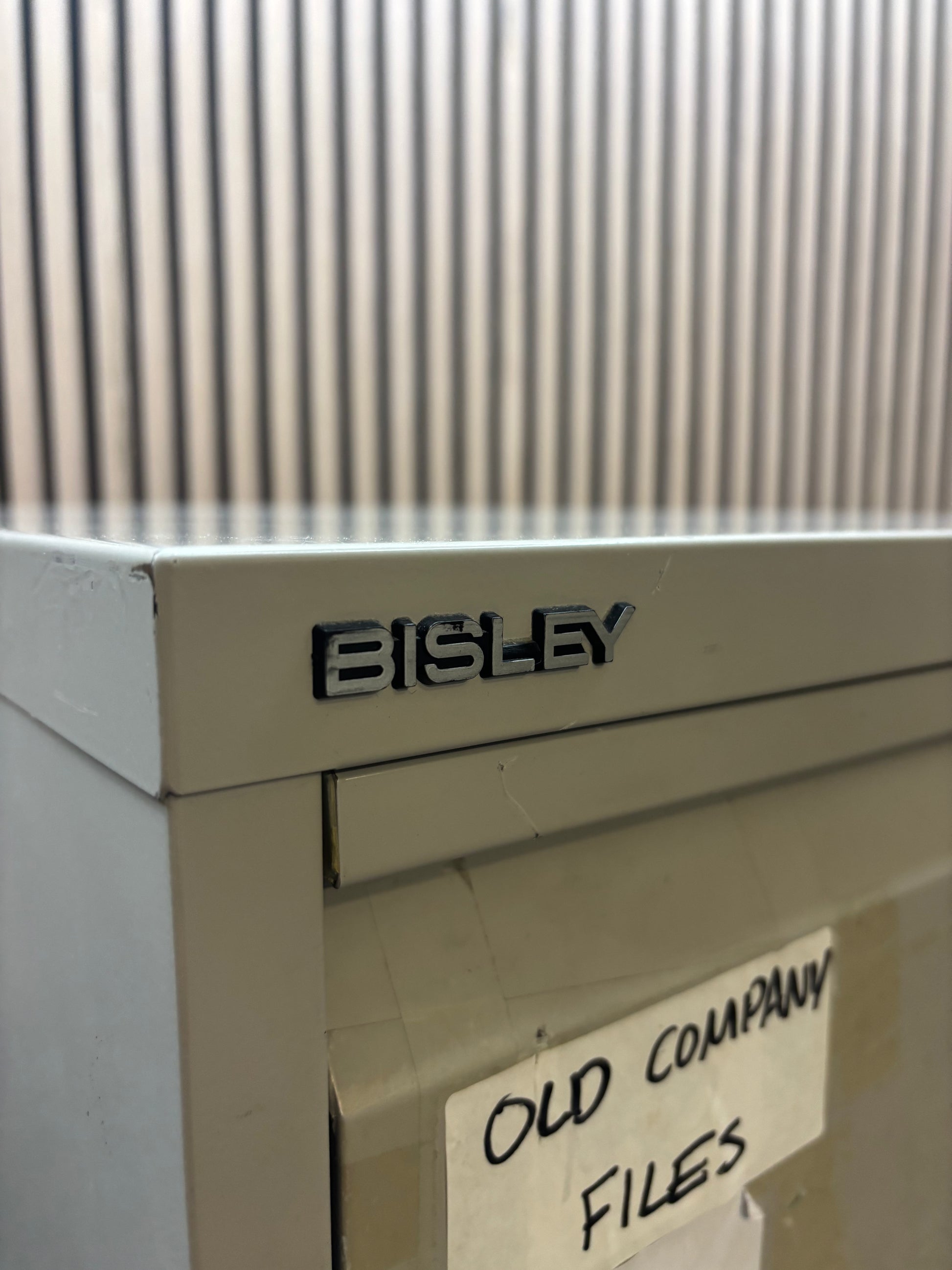 Bisley 4 drawer filing cabinet in grey metal