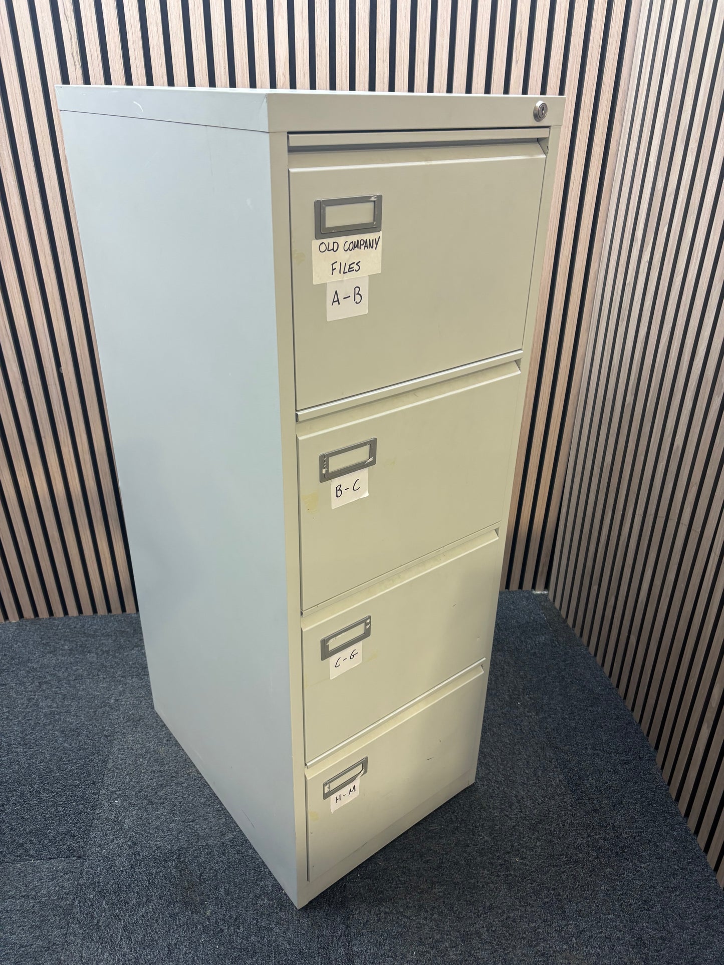 Grey metal 4 drawer filing cabinet
