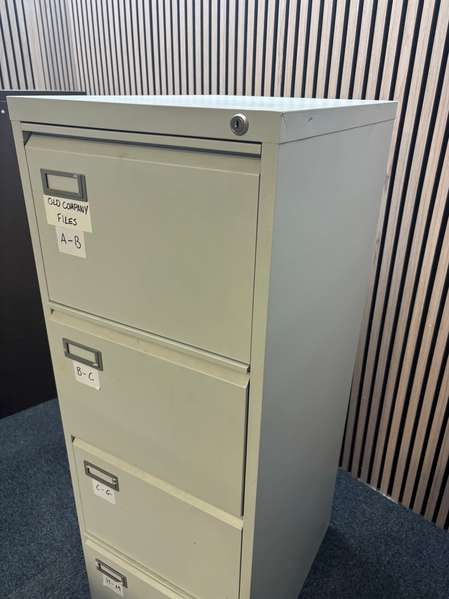 Grey metal 4 drawer filing cabinet