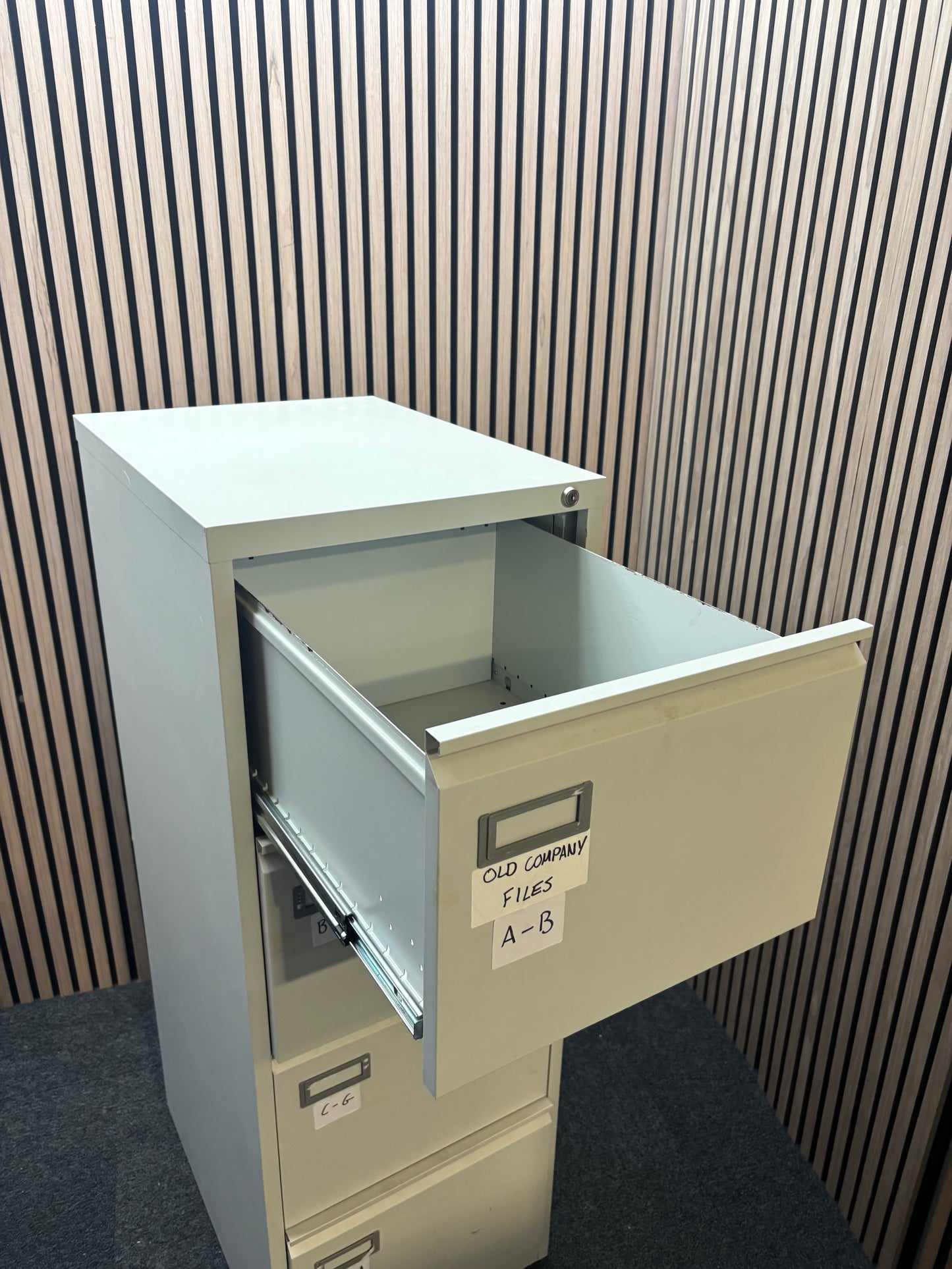 Grey metal 4 drawer filing cabinet