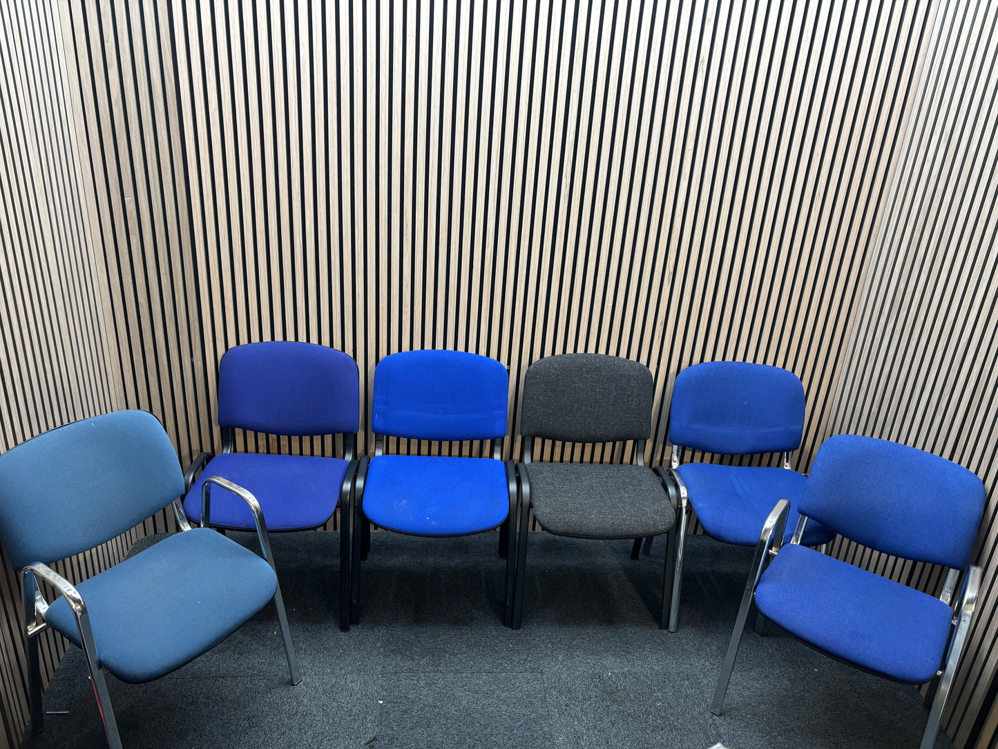 Medium blue fabric chrome framed stacking chair