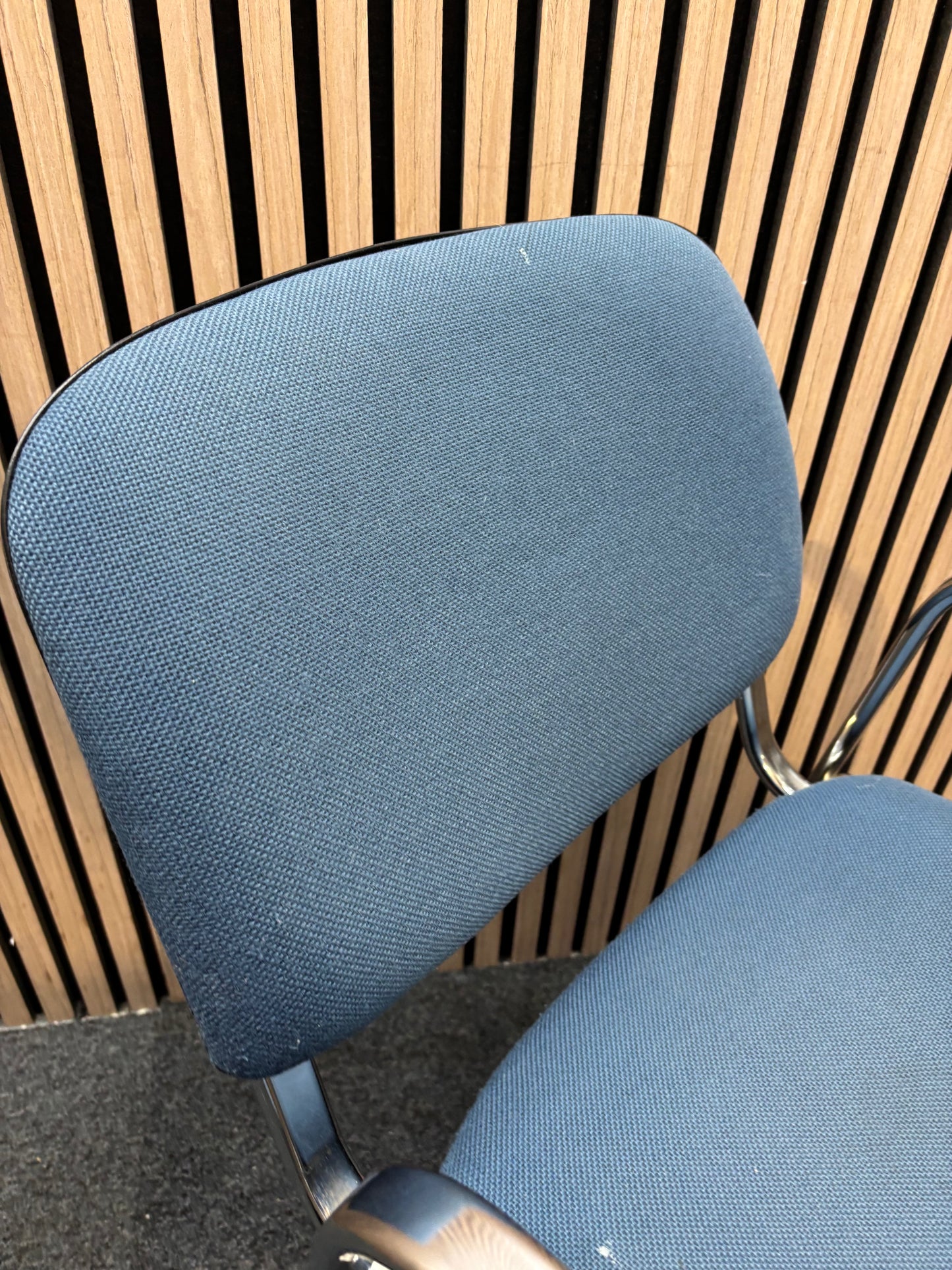 Light blue fabric chrome framed stacking chair
