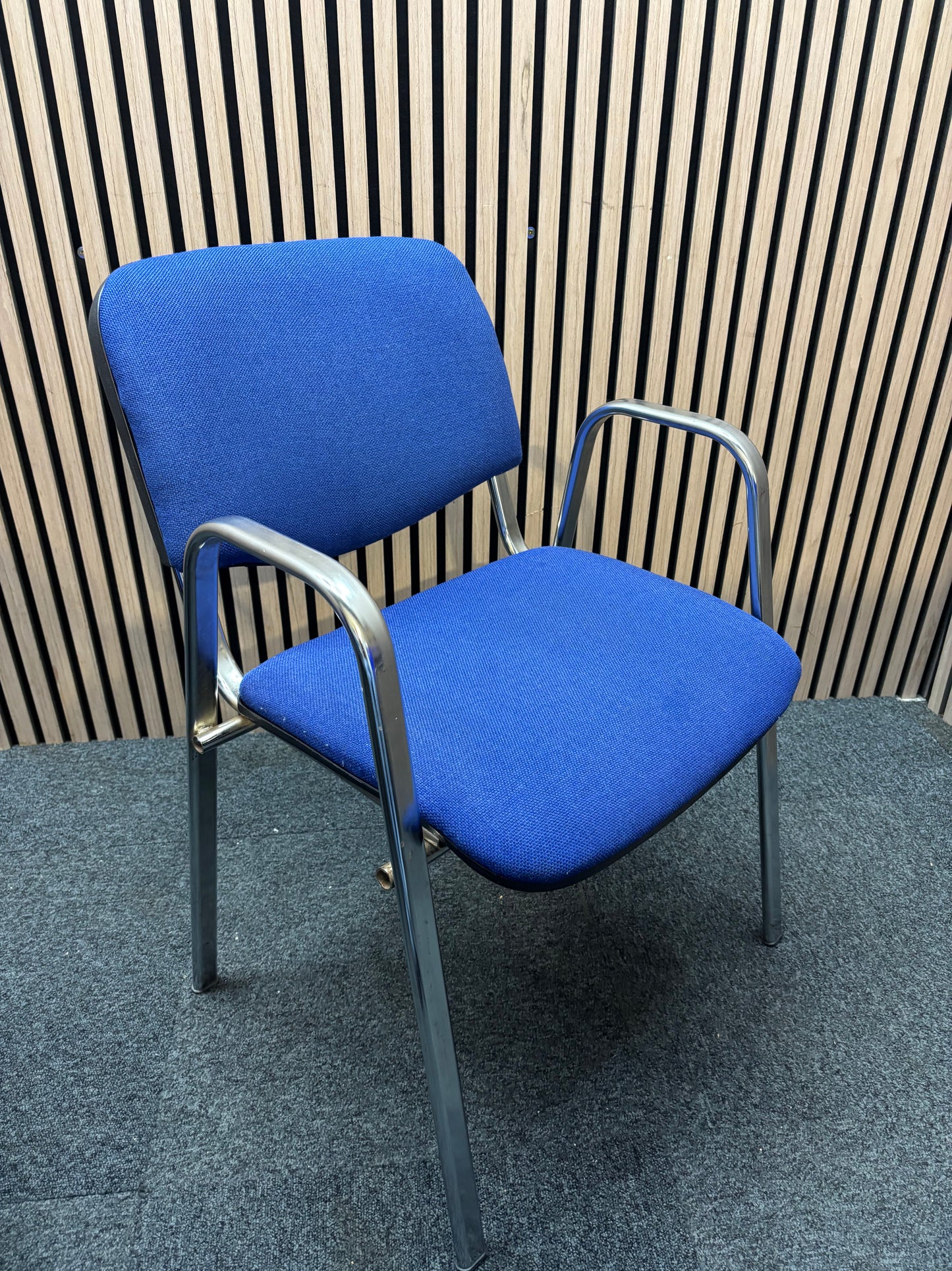 Light blue fabric chrome frame stacking chair with arms