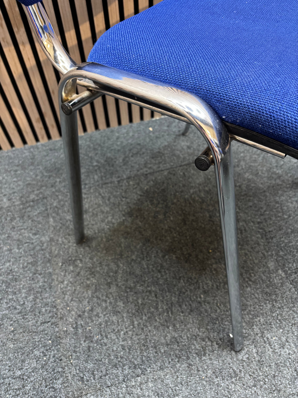 Dark blue fabric chrome framed stacking chair