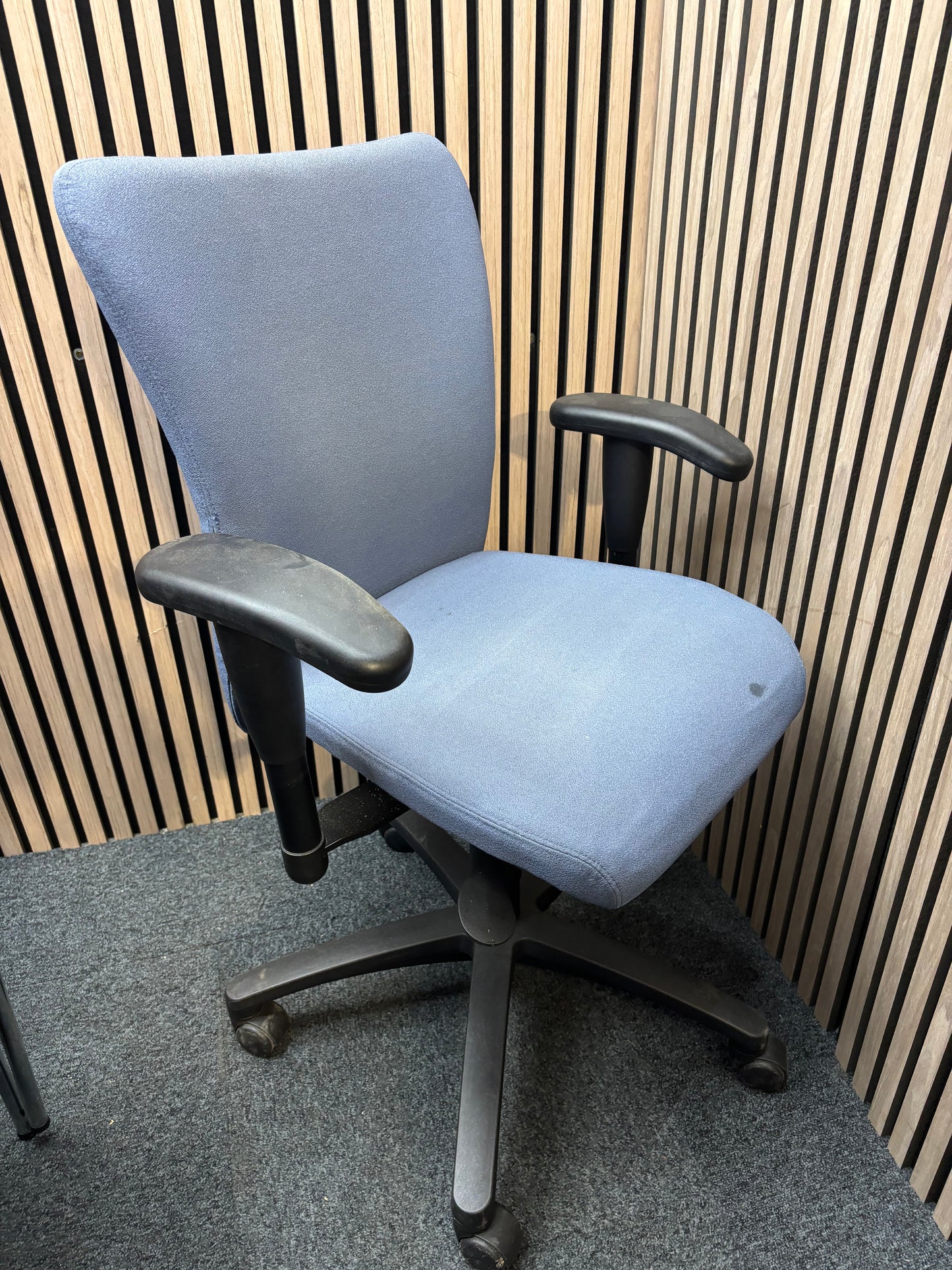 Blue fabric secondhand high back swivel chair with black 5 star base and adjustable arms