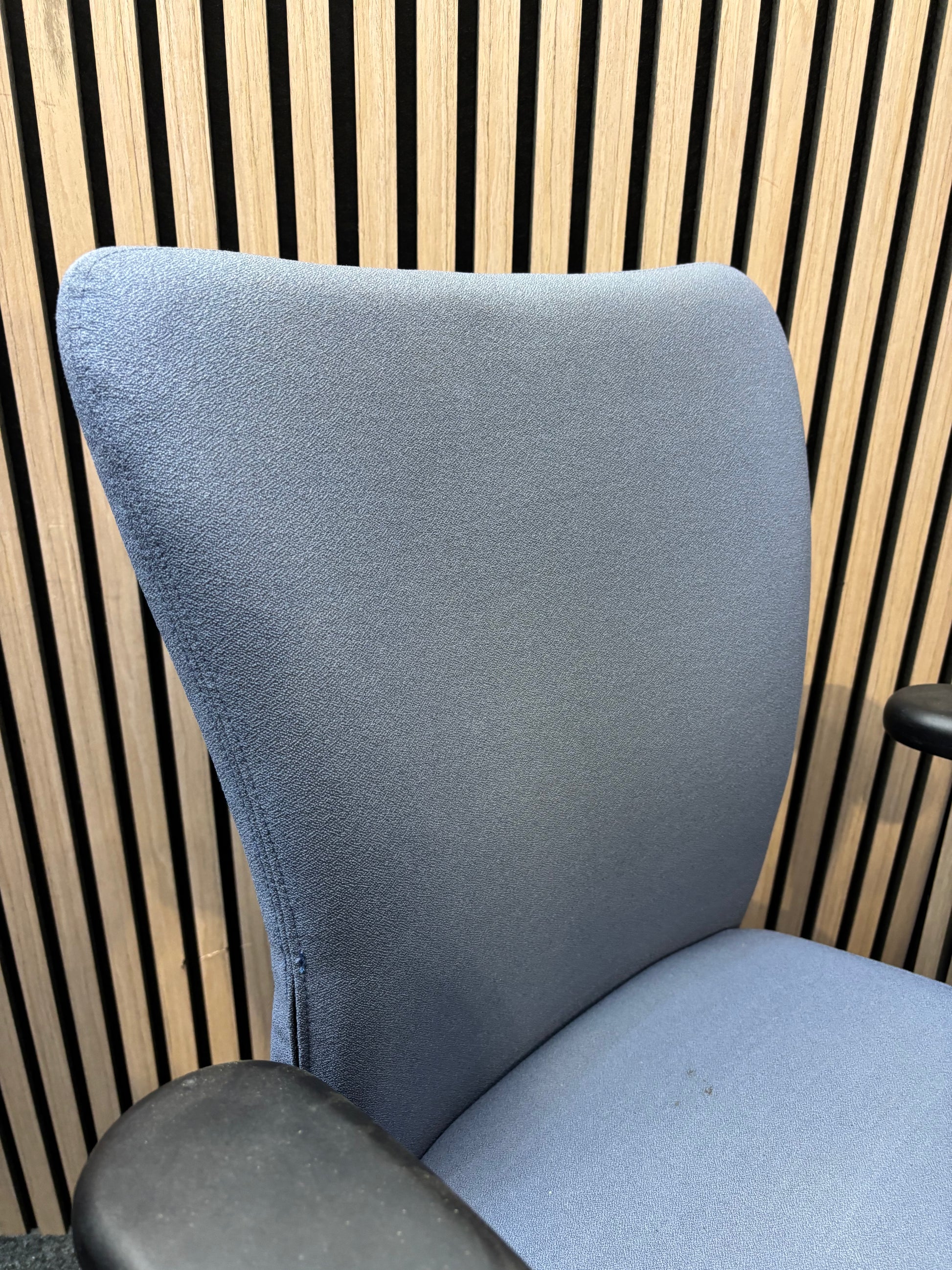 Blue fabric secondhand high back swivel chair with black 5 star base and adjustable arms
