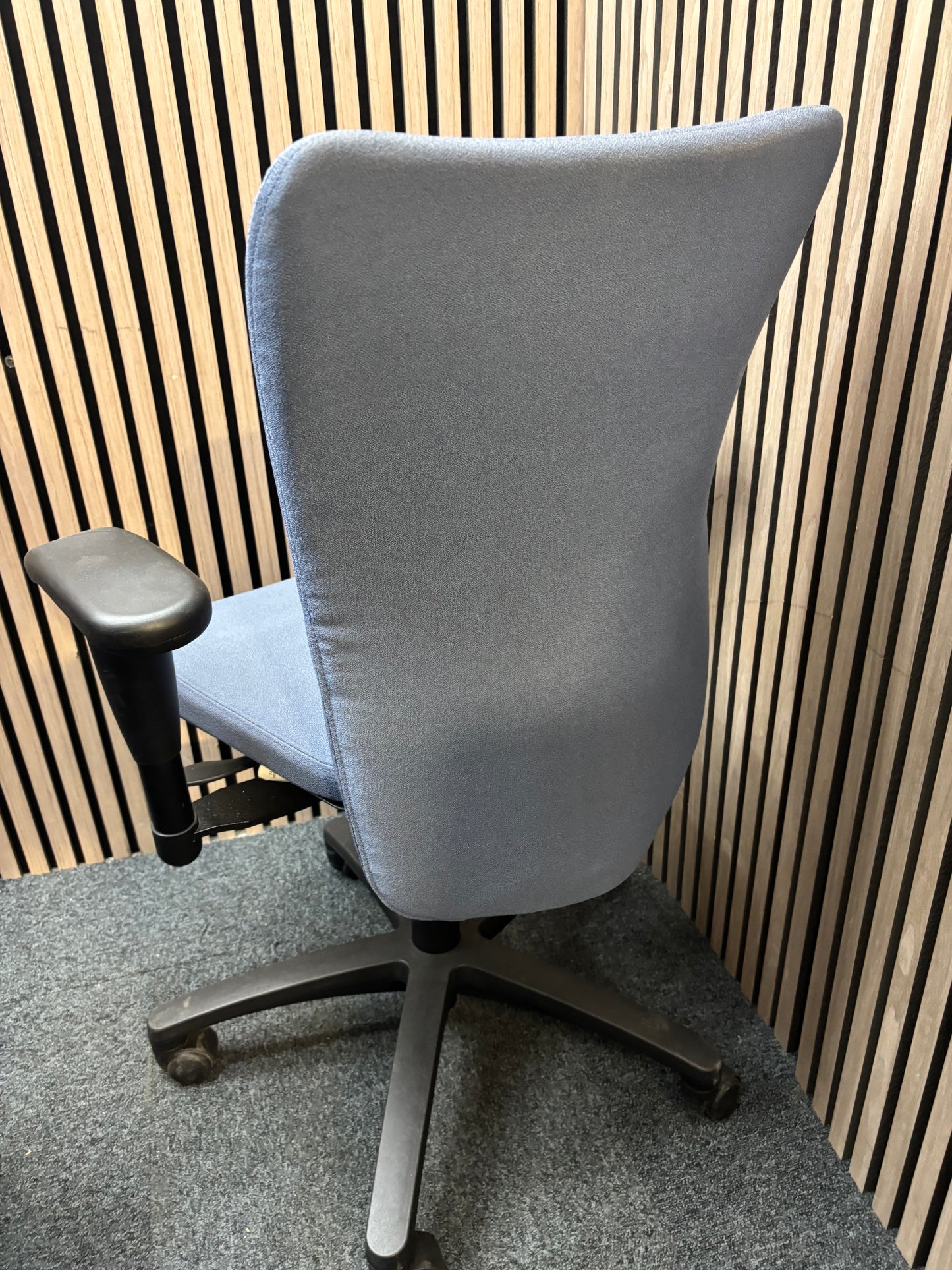 Blue fabric secondhand high back swivel chair with black 5 star base and adjustable arms