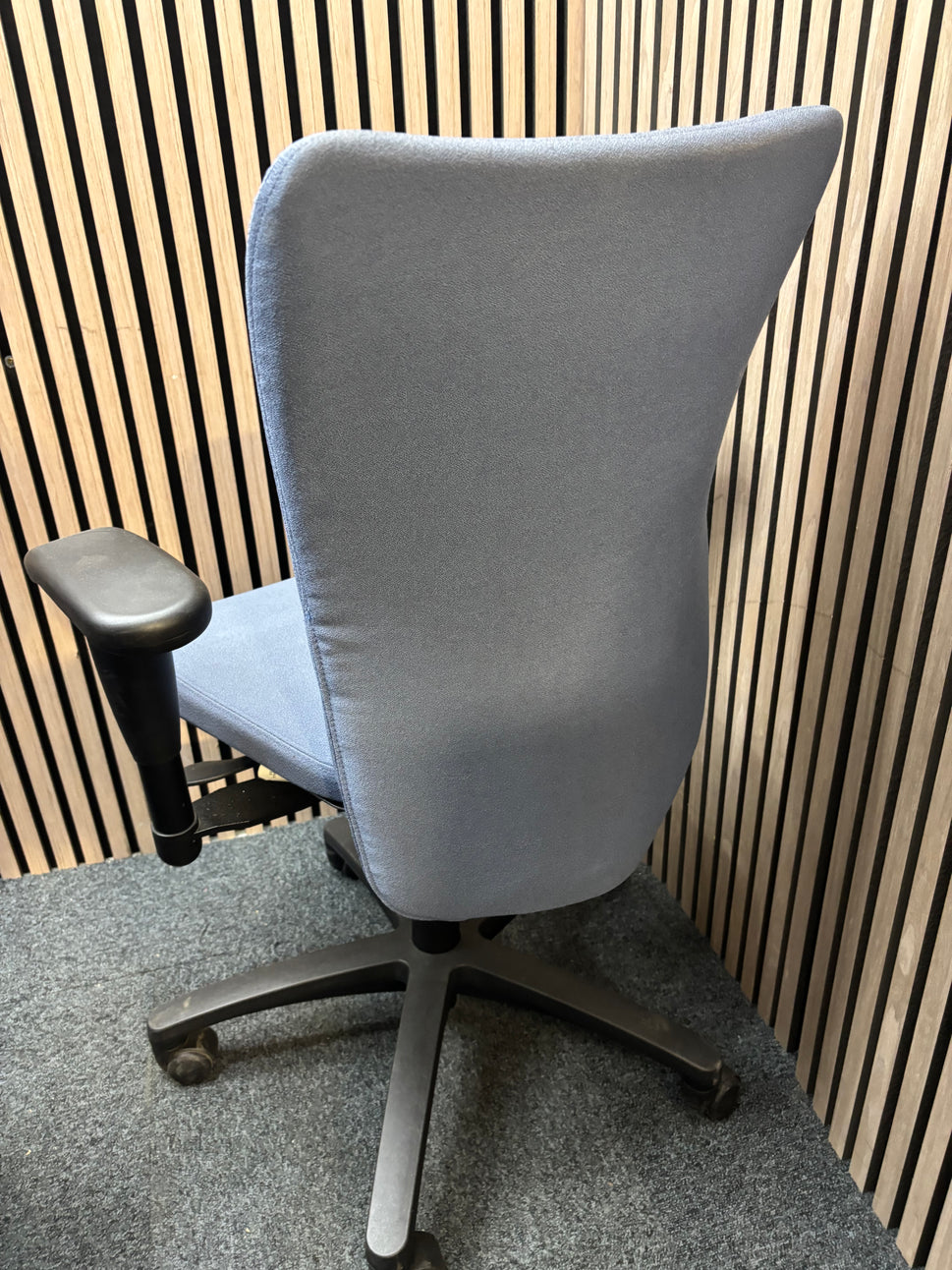 Blue fabric secondhand high back swivel chair with black 5 star base and adjustable arms