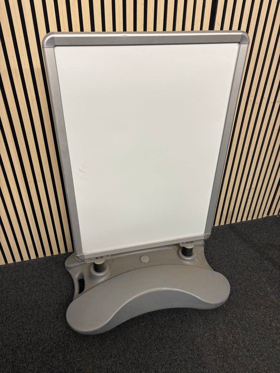 Large white plastic sandwich board on stand