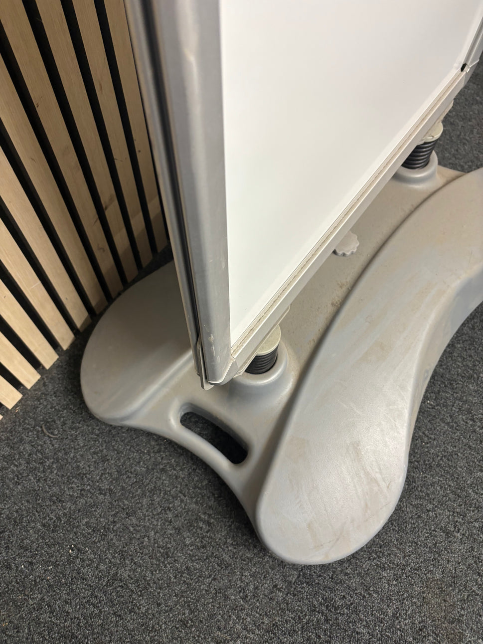 Large white plastic sandwich board on stand
