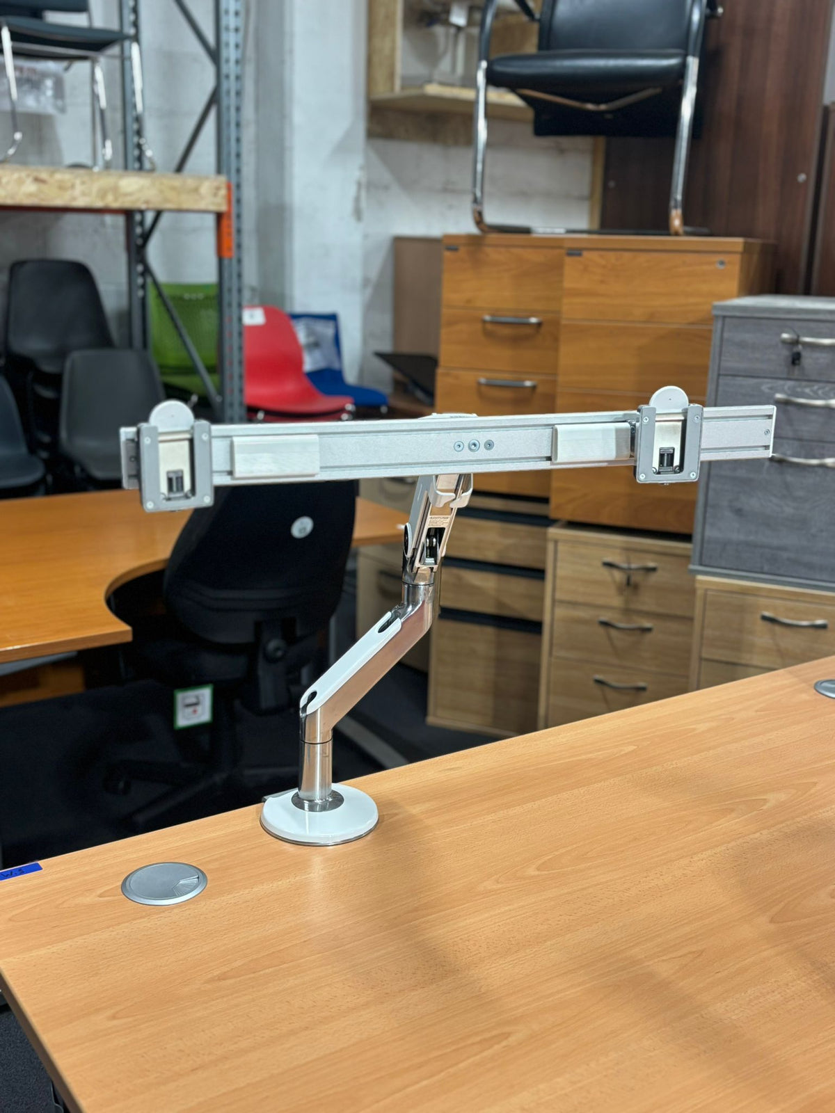 Desk mounted double monitor arm human scale chrome and metal finish
