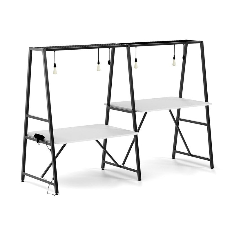 Trellis modular worktable with sit and stand heights in a black solid metal frame