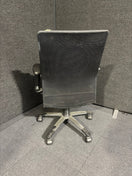 Switch LAST ONE 
DAMAGED ARM 
High back black leather and mesh executive swivel chair with polished metal base and height adjustable arms 2 image
