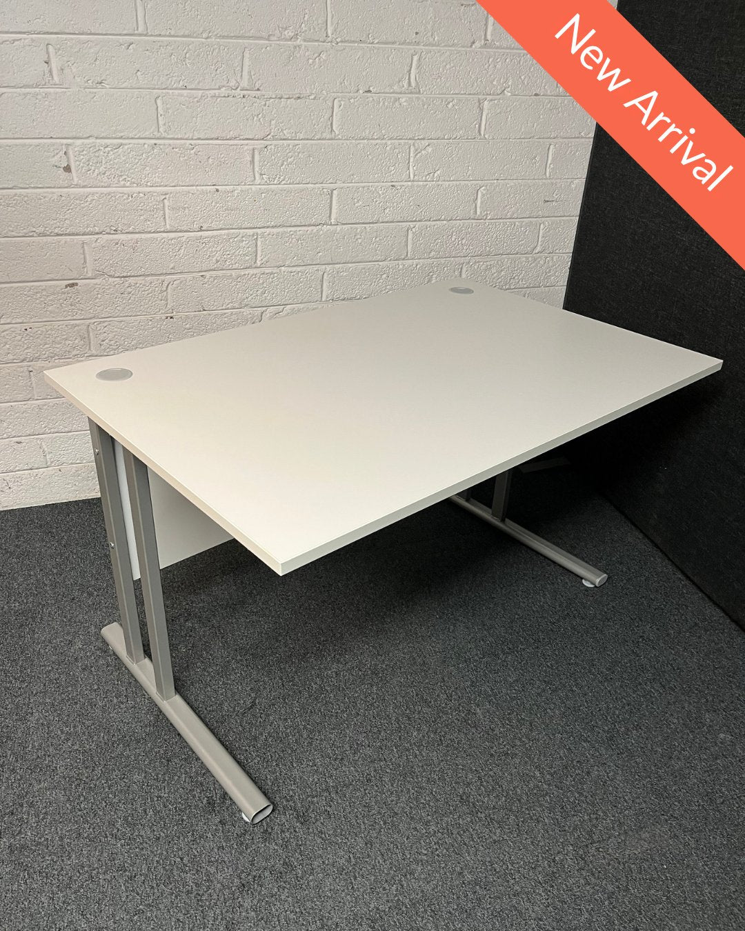 SECONDHAND 1200Lx800Dx720H White cantilever desk with silver metal frame and white modestly panel. IN EXCELLENT CONDITION. Price inclusive of VAT