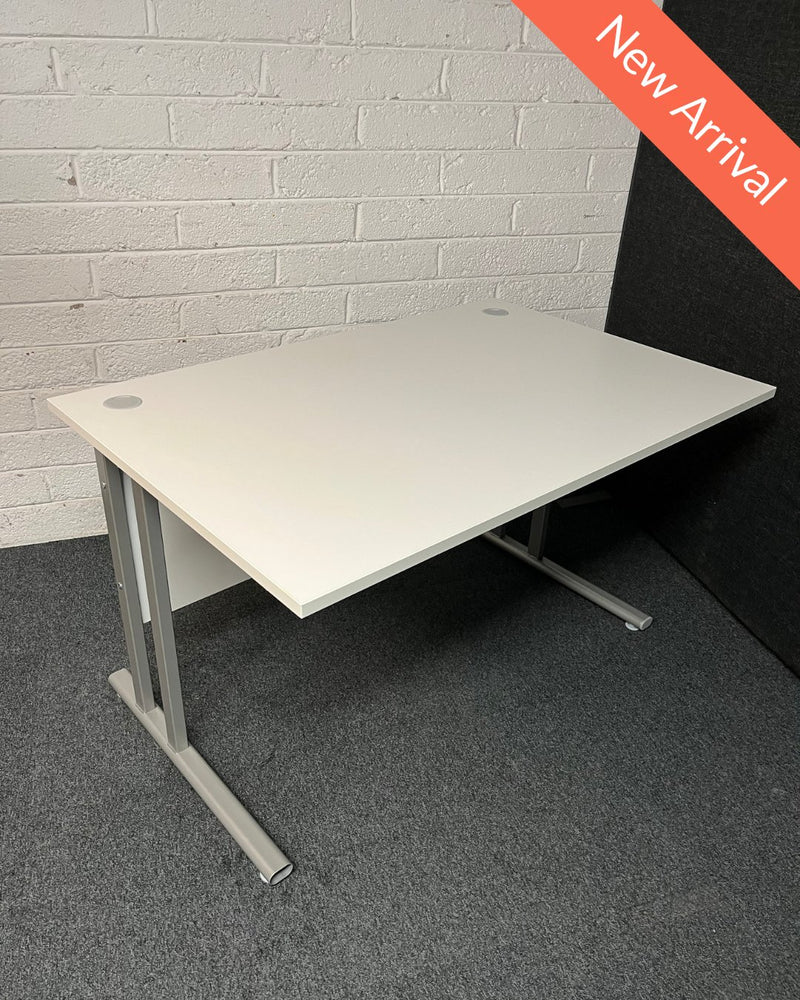 SECONDHAND 1200Lx800Dx720H White cantilever desk with silver metal frame and white modestly panel. IN EXCELLENT CONDITION. Price inclusive of VAT