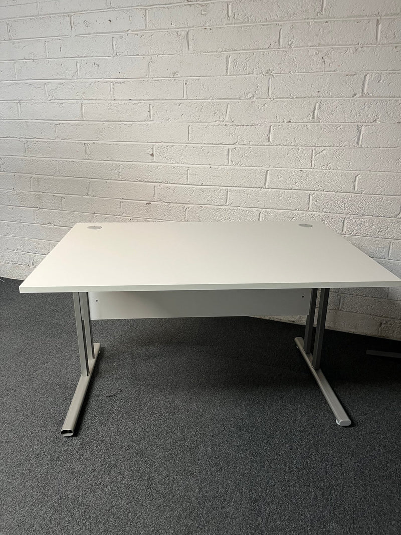 SECONDHAND 1200Lx800Dx720H White cantilever desk with silver metal frame and white modestly panel. IN EXCELLENT CONDITION. Price inclusive of VAT