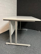 SECONDHAND 1200Lx800Dx720H White cantilever desk with silver metal frame and white modestly panel. IN EXCELLENT CONDITION. Price inclusive of VAT