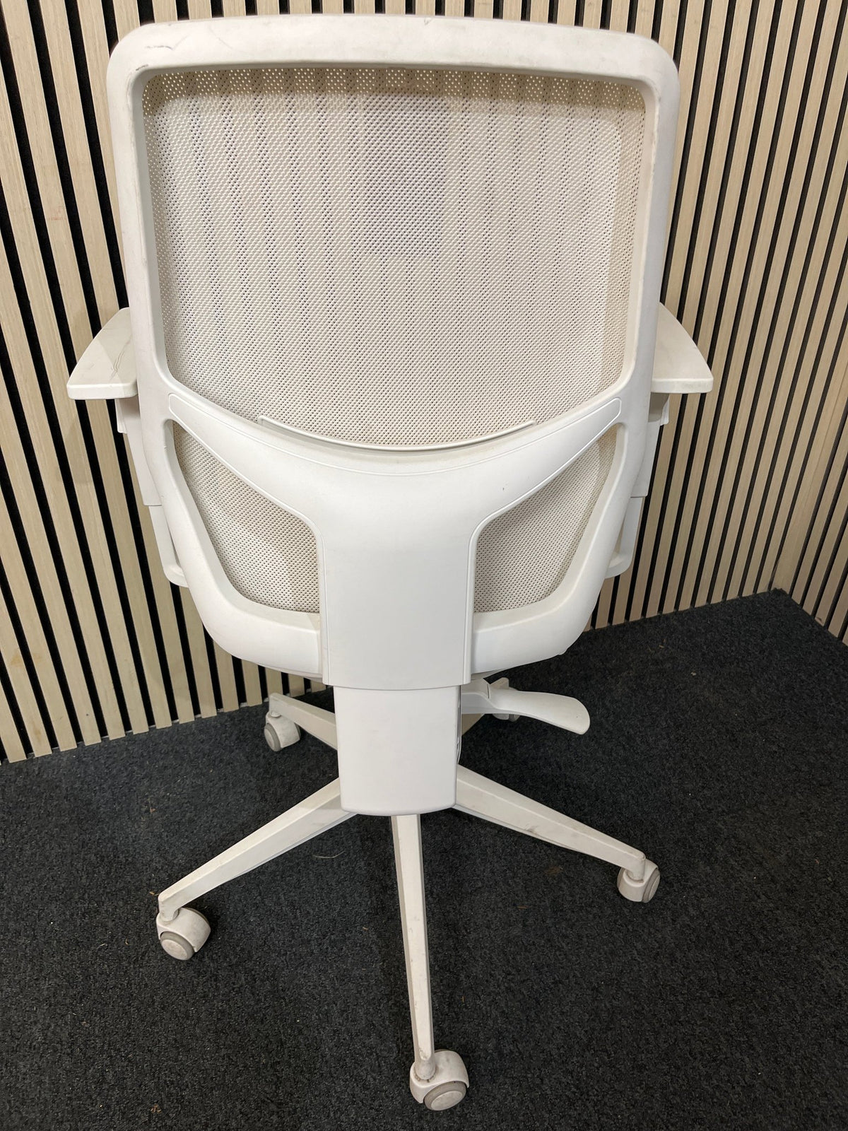 Orangebox mesh back, dark blue seat fabric swivel chair, metal 5 star base on castors. Add Add arms for €40.00 1425