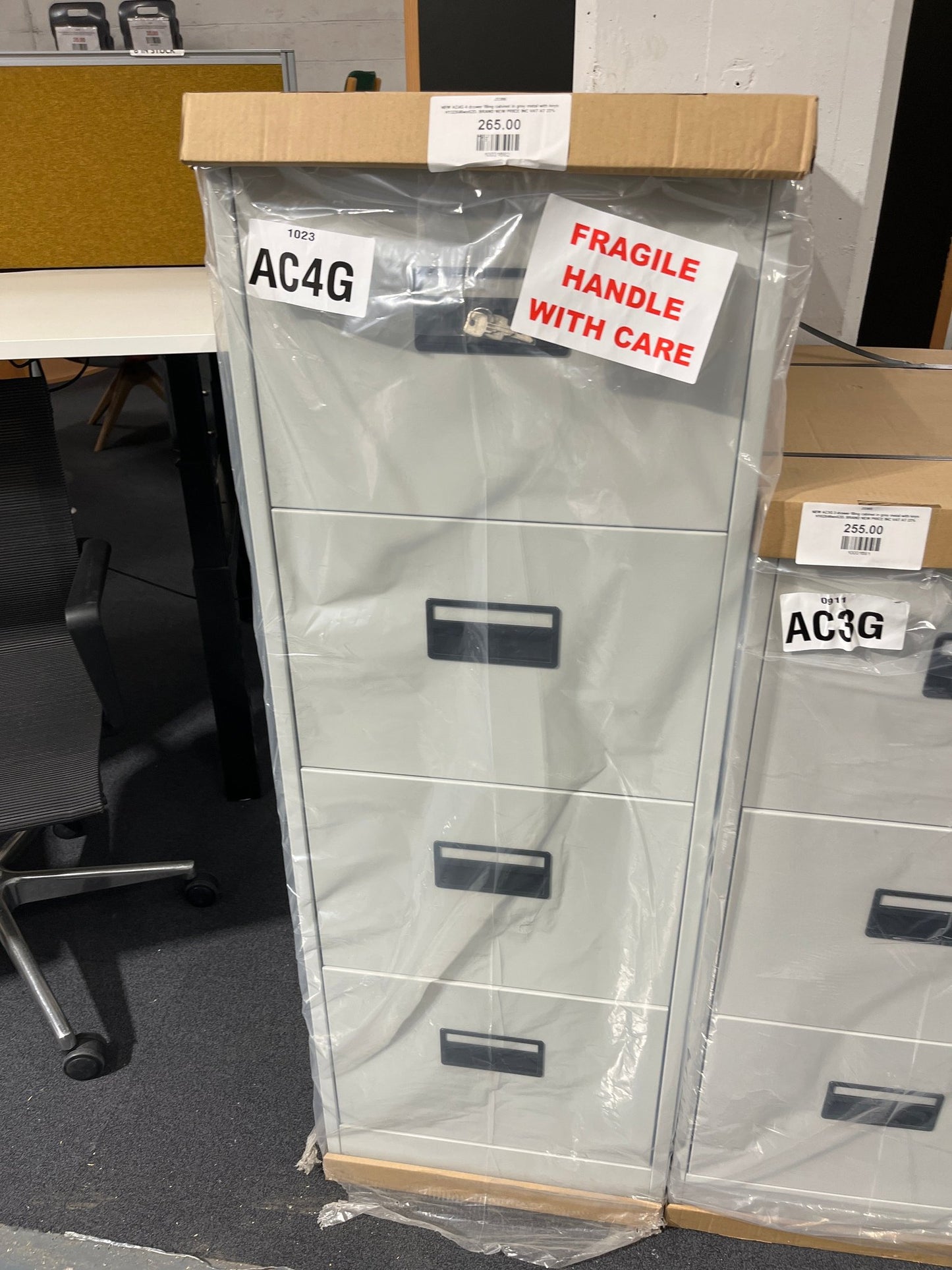 NEW AC4G 4 drawer filing cabinet in grey metal with keys H132X46wx62D. BRAND NEW PRICE INC VAT AT 23%