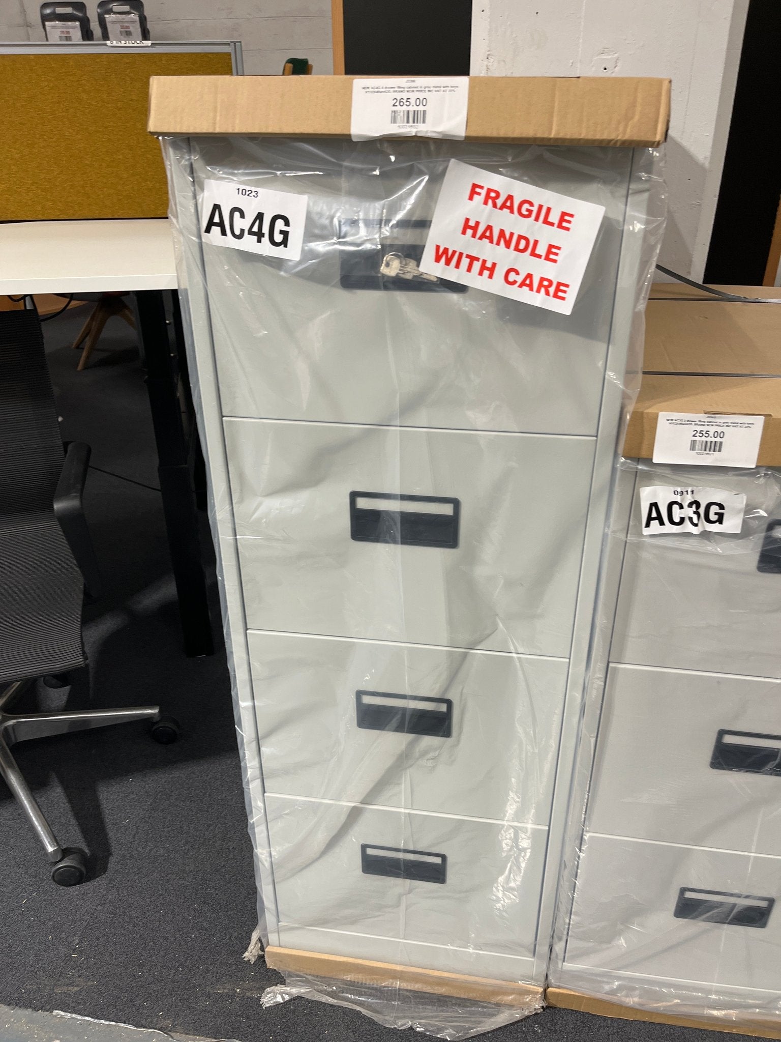NEW AC4G 4 drawer filing cabinet in grey metal with keys H132X46wx62D. BRAND NEW PRICE INC VAT AT 23%