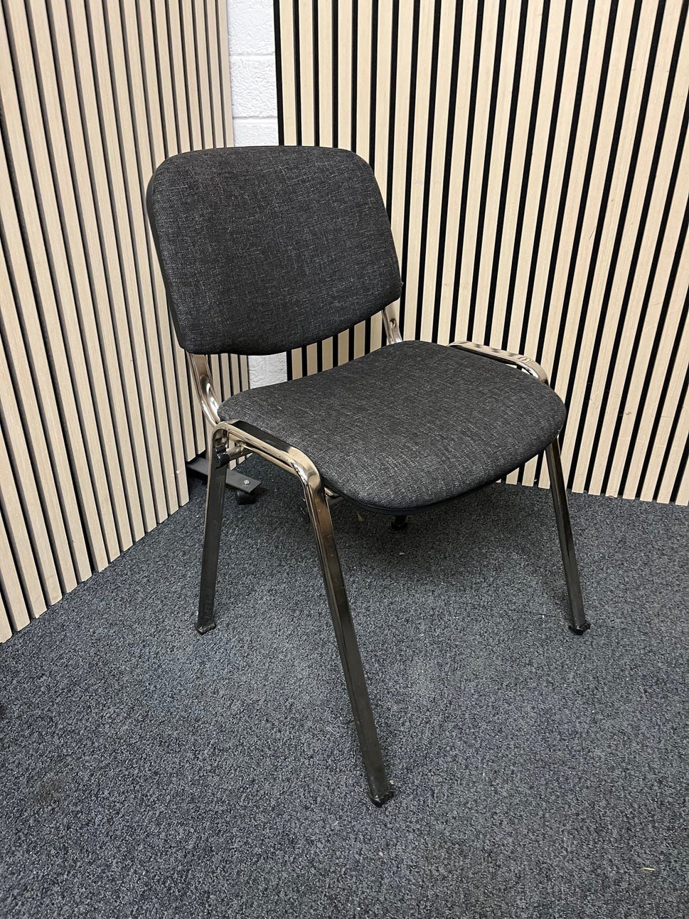 Chrome framed, charcoal fabric seat and back, stacking chair