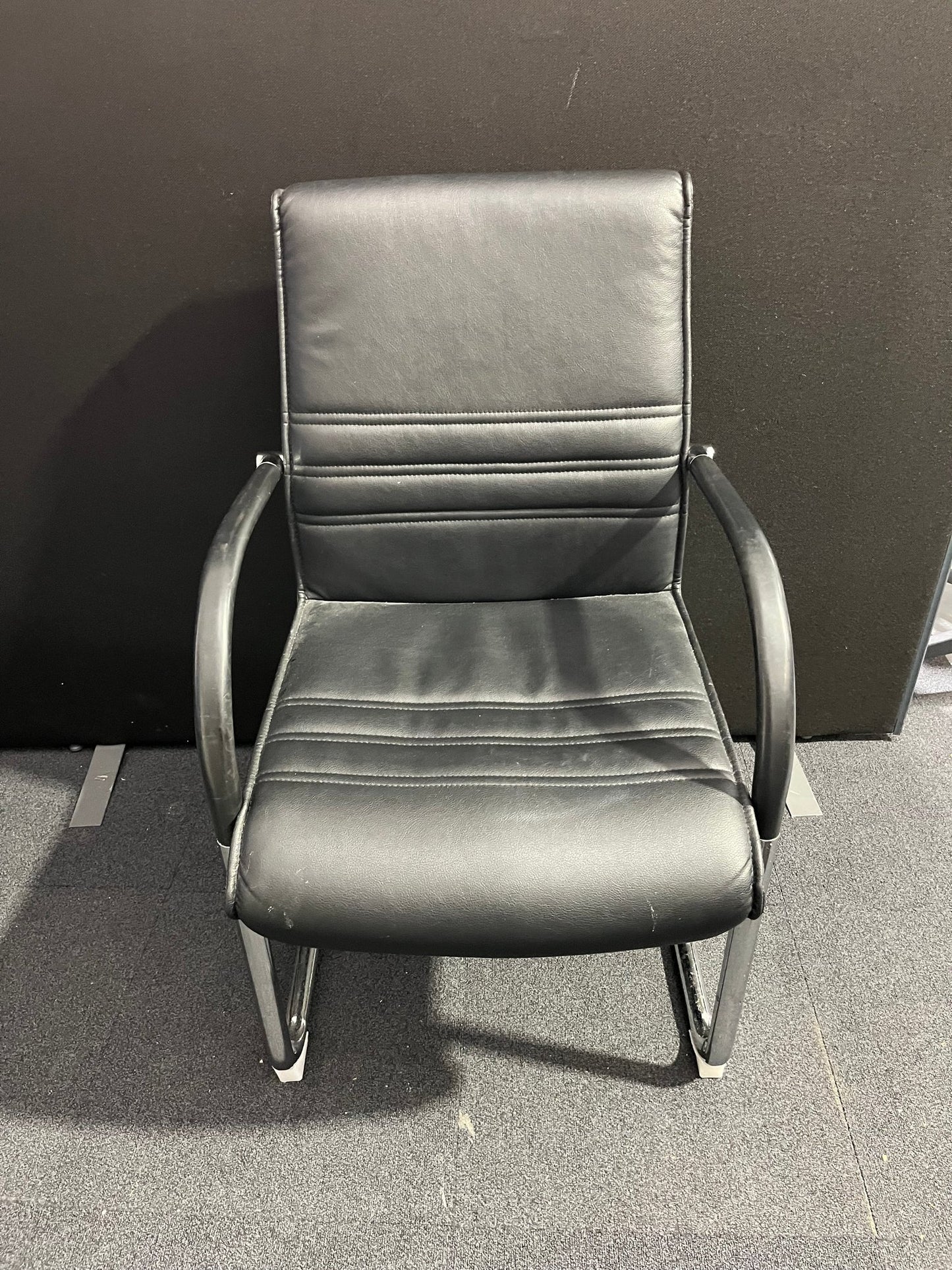 Black leather cantilever meeting chair with chrome frame