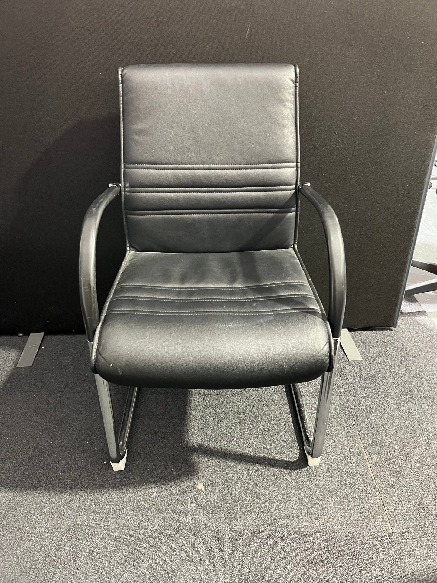 Black leather cantilever meeting chair with chrome frame