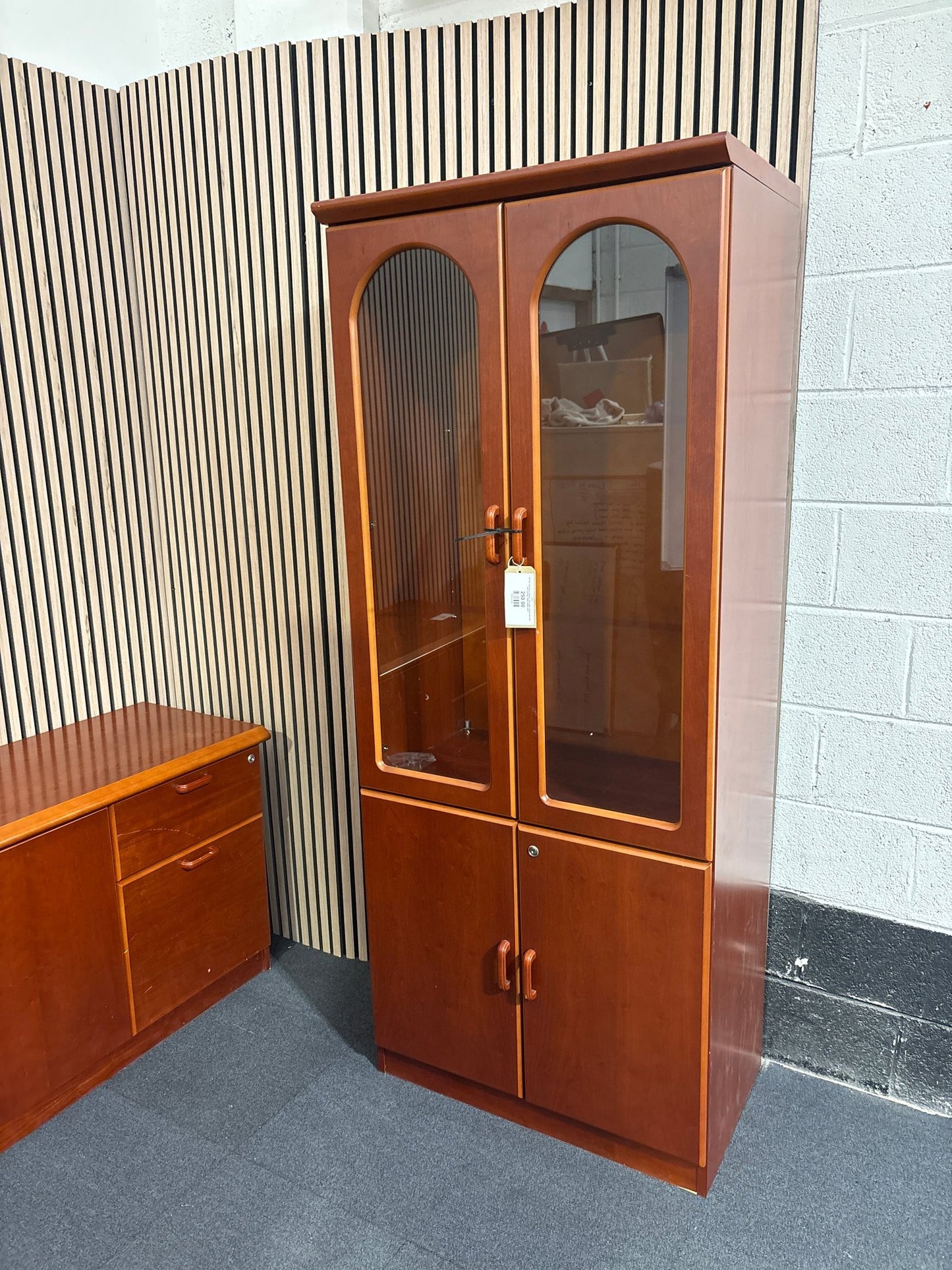 Tall dark mahogany stained 4 door glass display unit with base storage 1950Hx800Wx500D