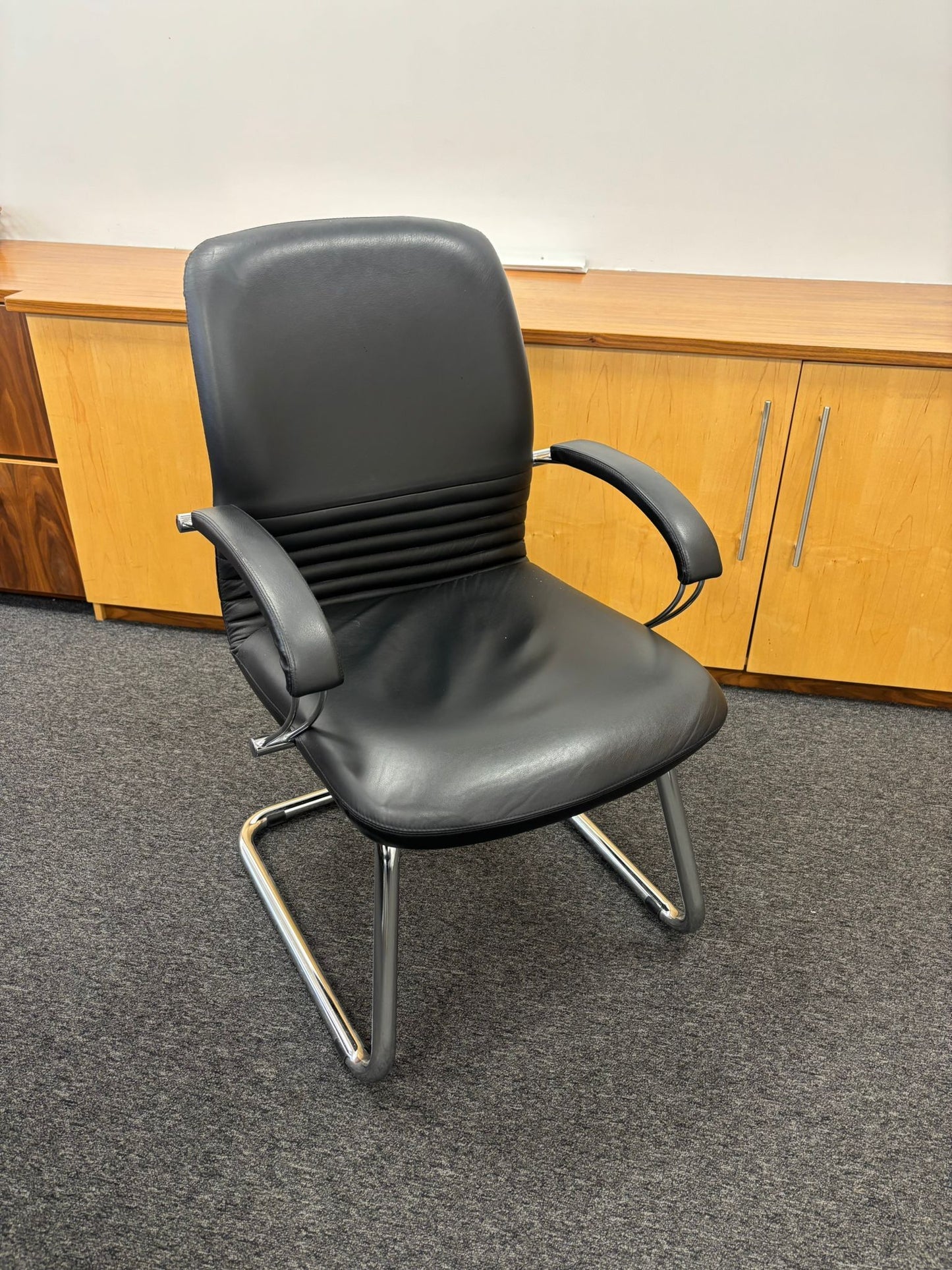 Black leatherette chrome framed meeting chair with arms