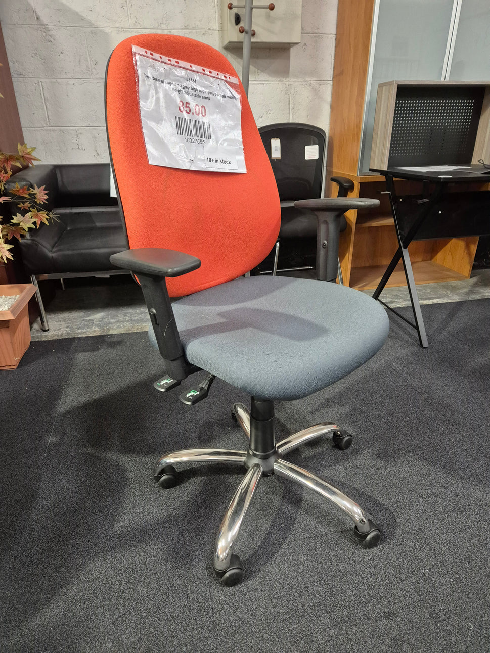Two tone orange and grey high back swivel chair with height adjustable arms