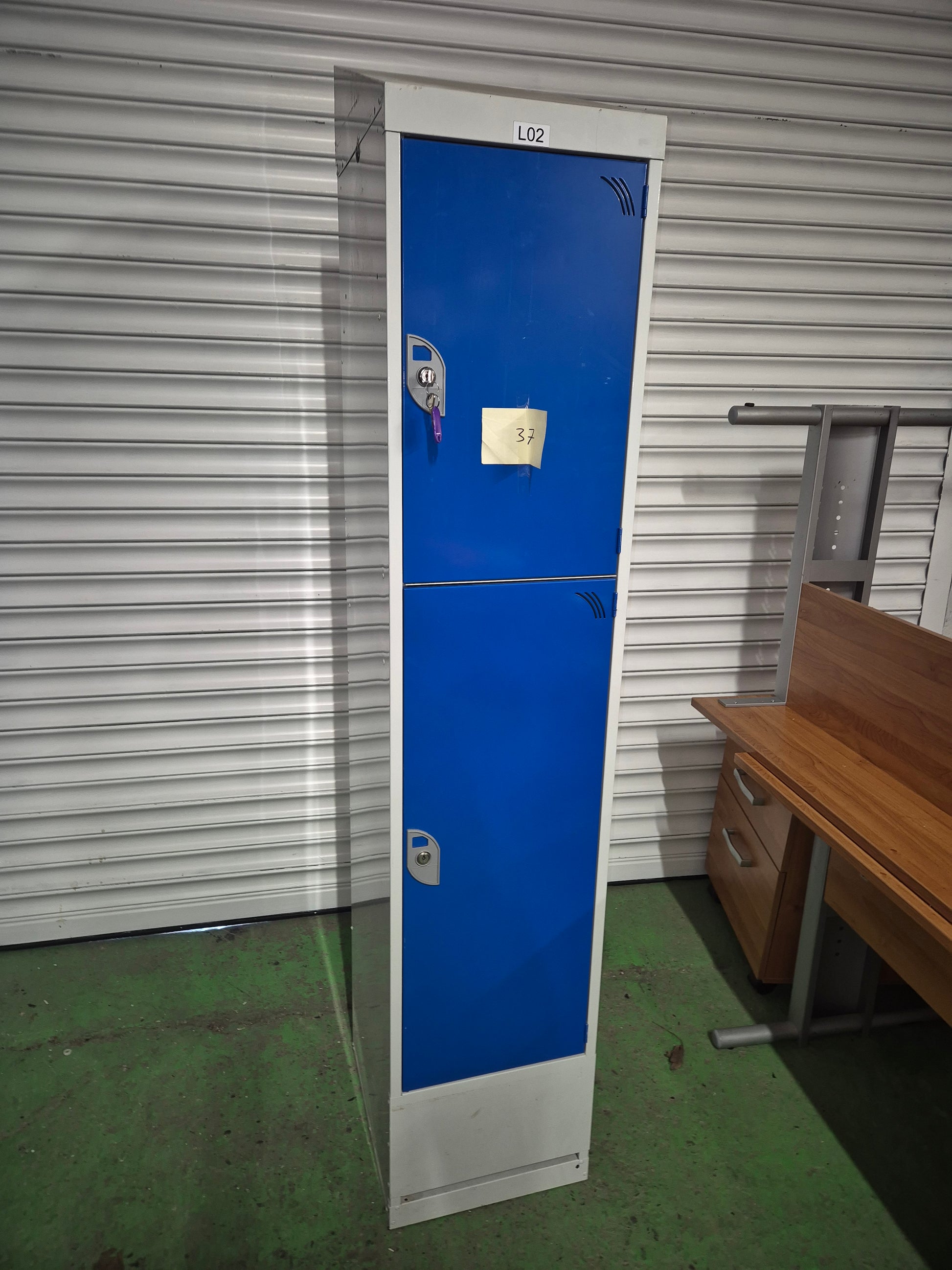 Tall 2 door personal locker, grey metal carcass with blue doors complete with keys