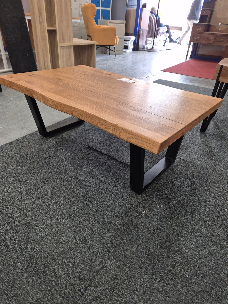 Solid Oak wood shaped coffee table on black metal frame  2125