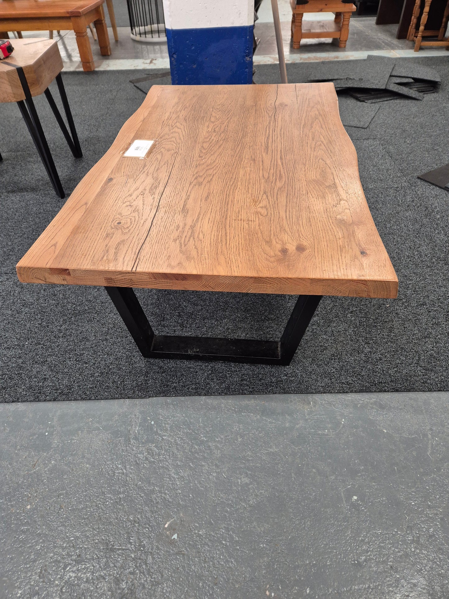 Solid Oak wood shaped coffee table on black metal frame  2125