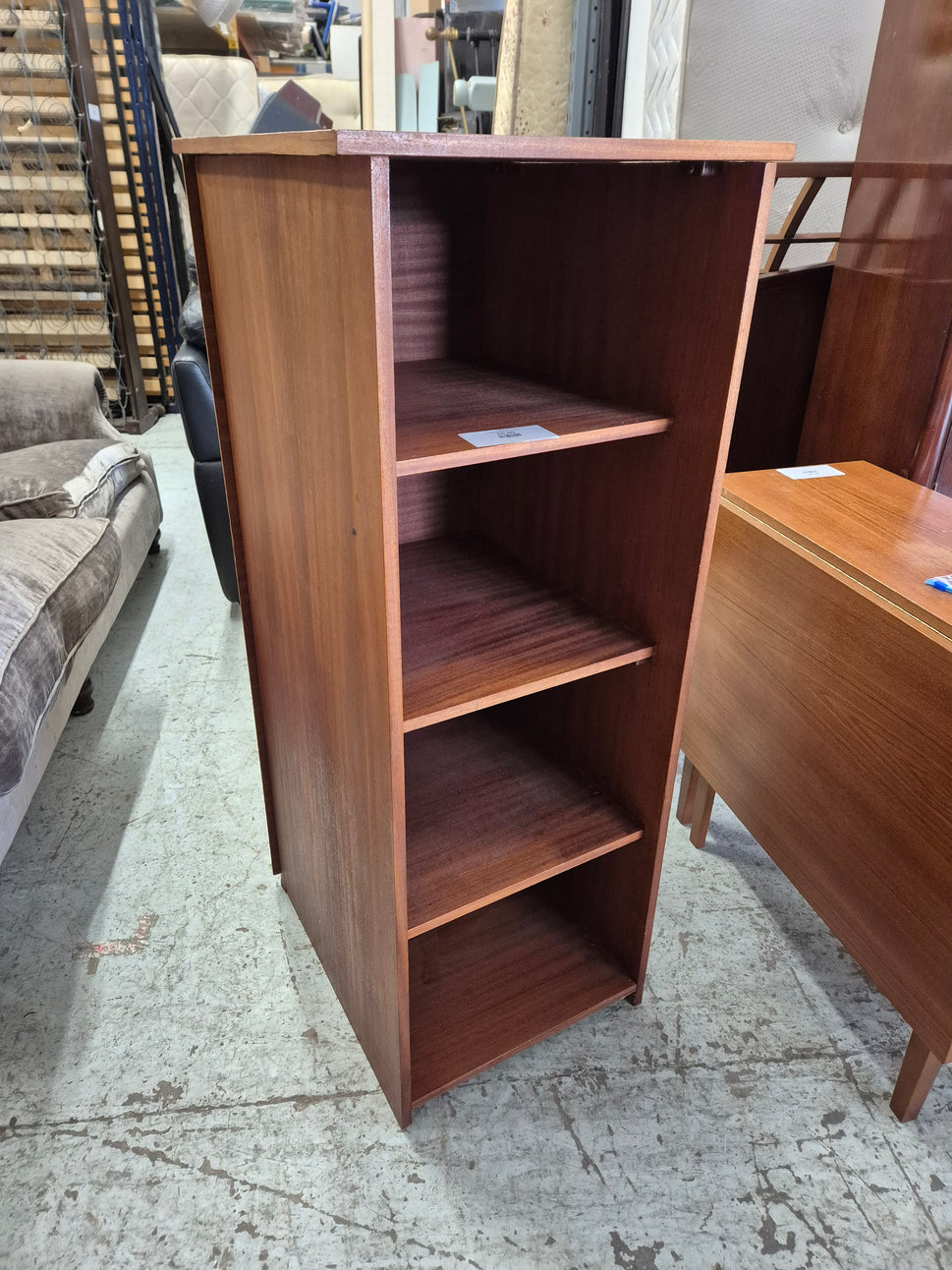 Tall open teak stained bookcase 