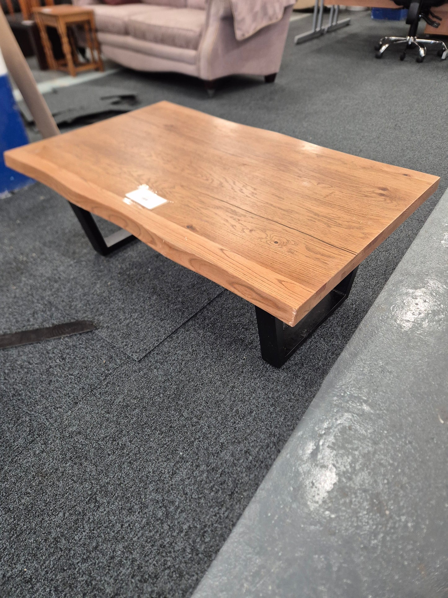 Solid Oak wood shaped coffee table on black metal frame  2125