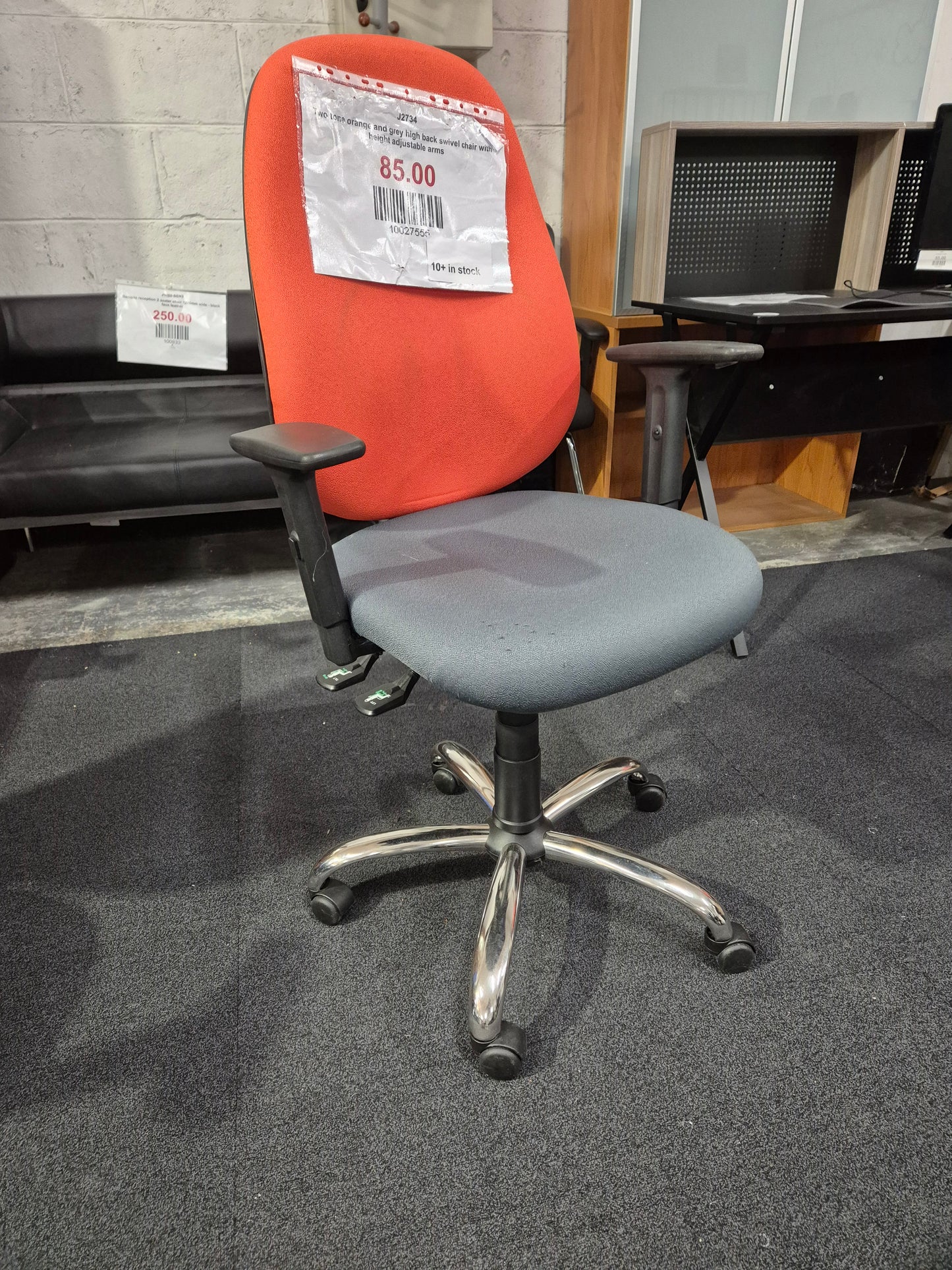 Two tone orange and grey high back swivel chair with height adjustable arms