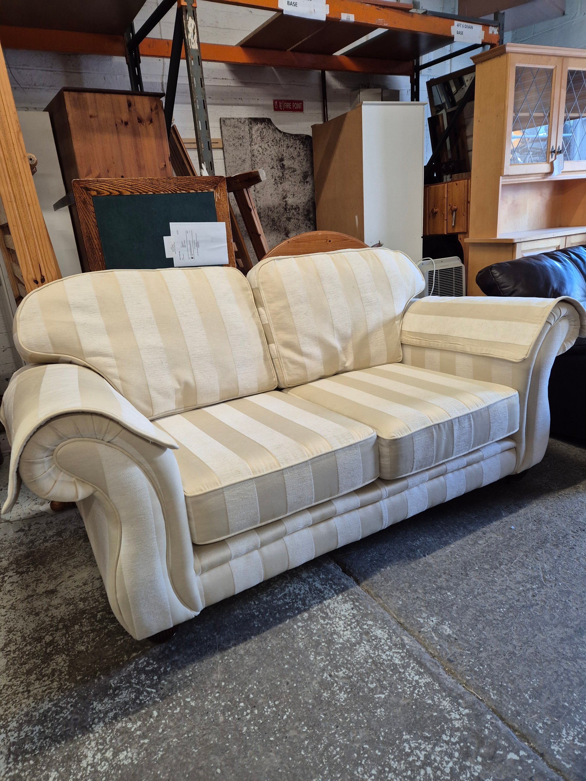 2 seater Finline roll back sofa in cream stripe fabric with brass castor legs  2125