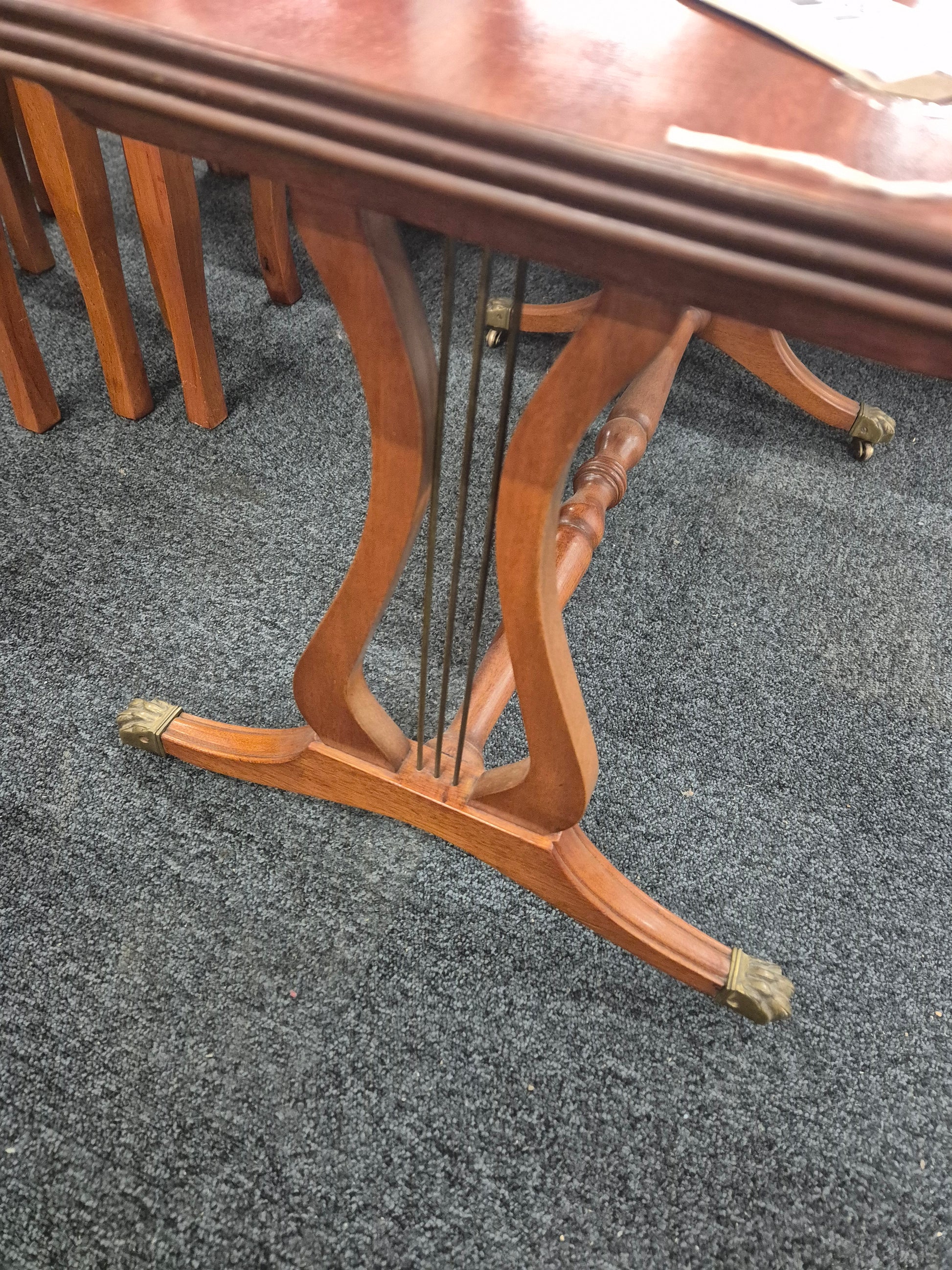 Low ornate mahogany coffee table on brass castors  3125