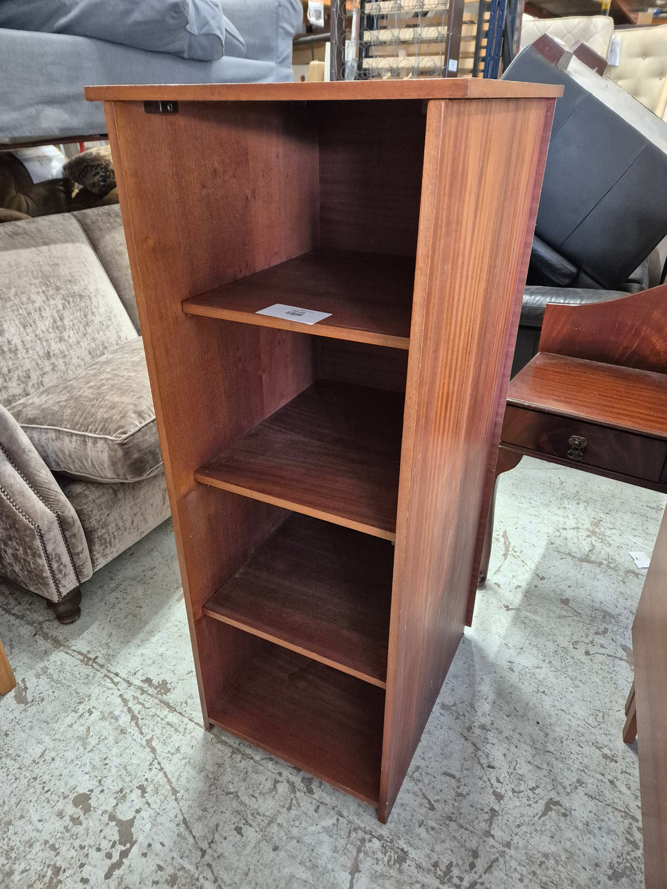 Tall open teak stained bookcase 