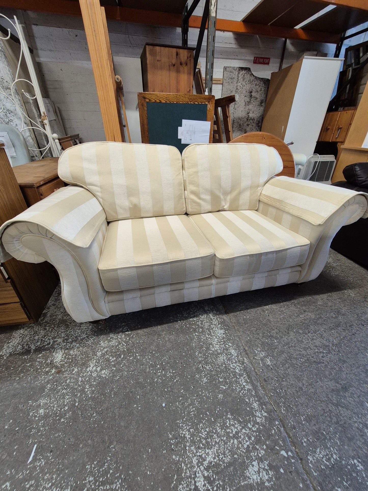 2 seater Finline roll back sofa in cream stripe fabric with brass castor legs  2125