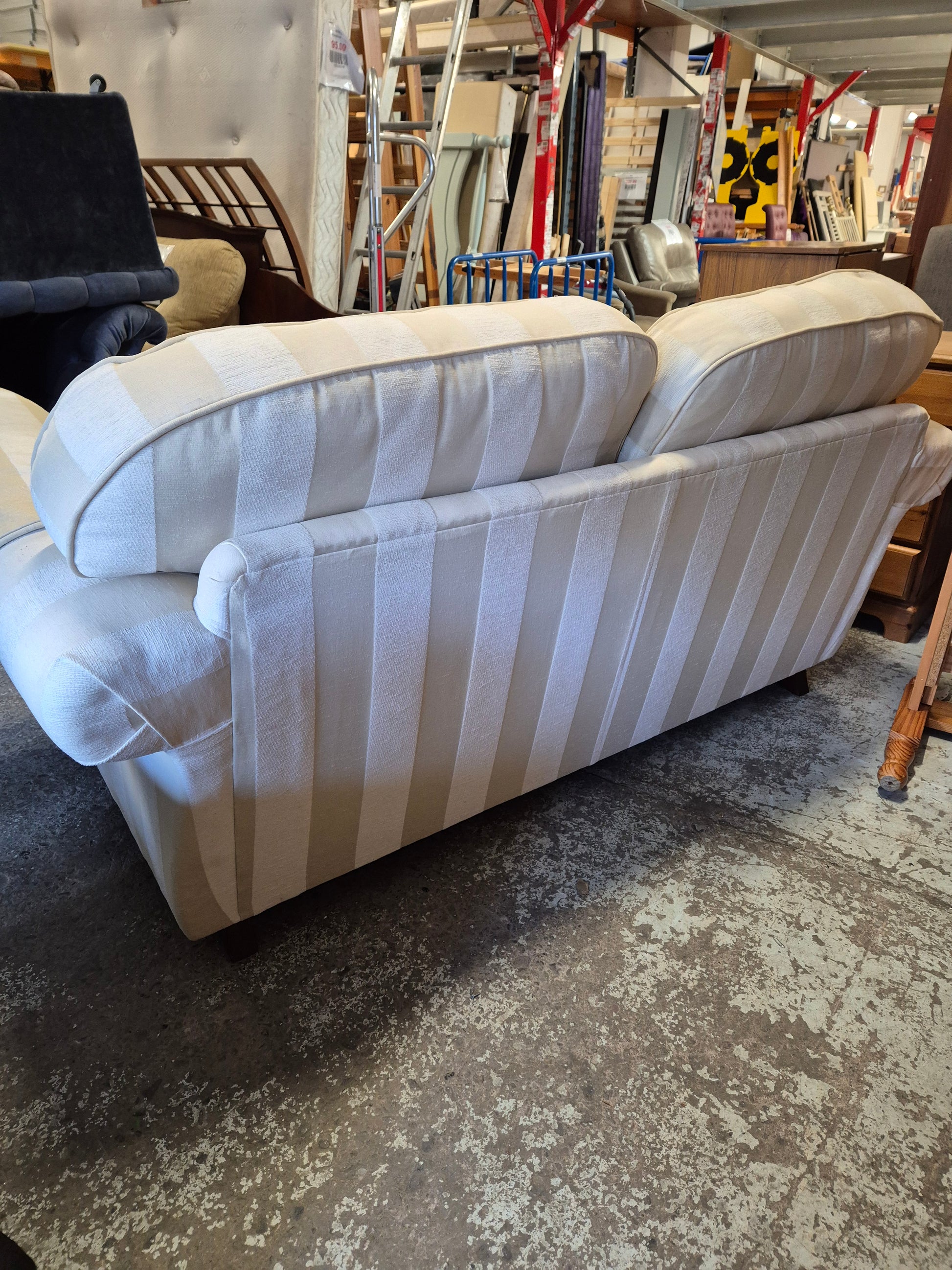 2 seater Finline roll back sofa in cream stripe fabric with brass castor legs  2125