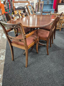 Switch Oval shaped mahogany extendable table on castors with matching  2 carver and 4 dining chairs with red fabric seat 2125 2 image